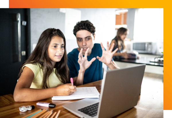 A student with dyslexia works with her teacher on Fast ForWord exercises.