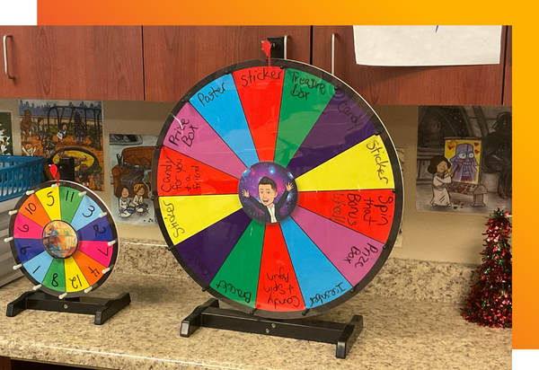 Math motivation prize wheel with colorful sections and prizes for students to win in math class.