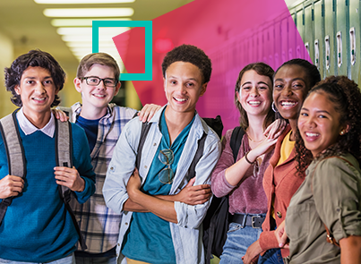 A group of teenage students looking at camera smiling; they are of diverse ethnicities because heritage and native speakers of Spanish can look different